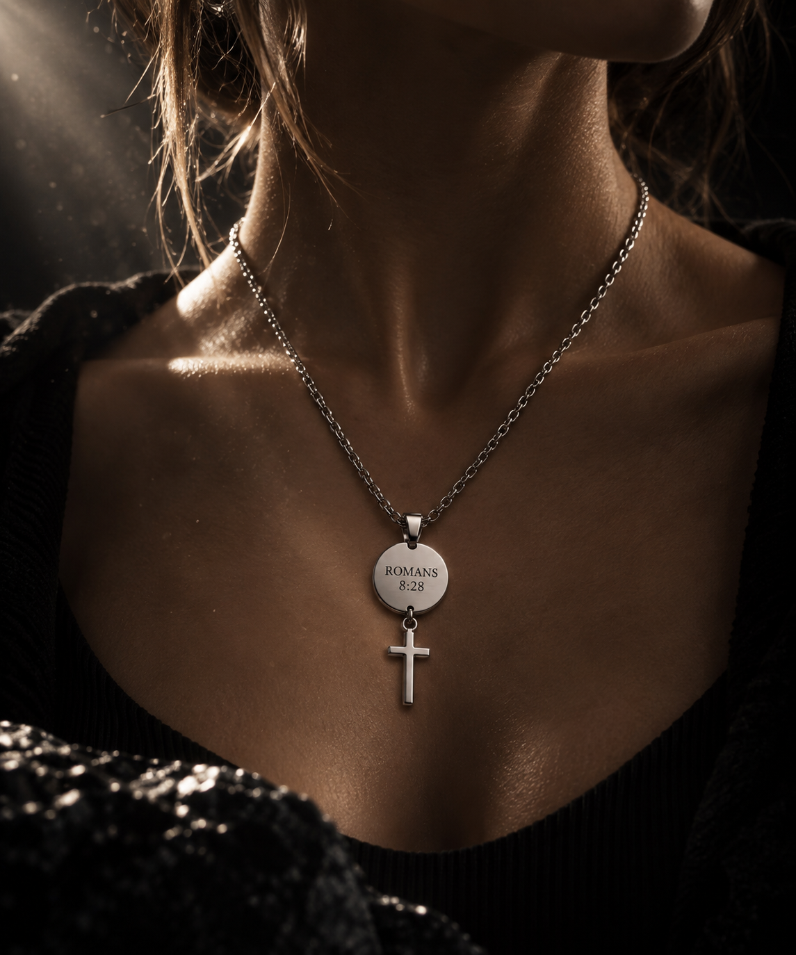 The medallion version of The Verse Necklace worn in warm light